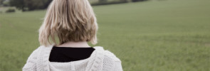 Woman Standing in a Field
