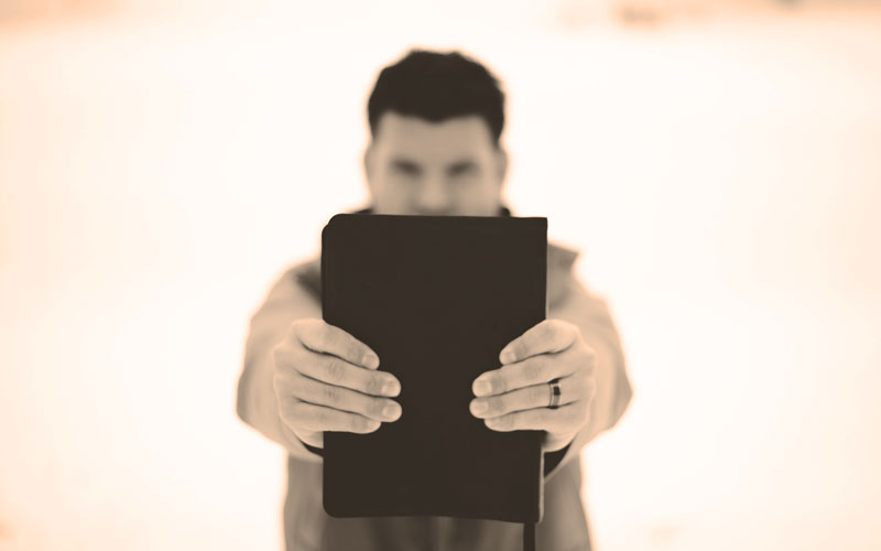 Man Holding Bible