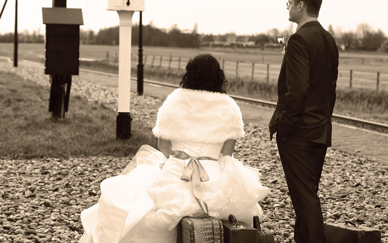 Married couple at train station