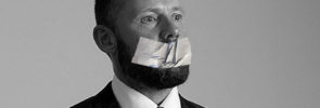 Man with duct tape over mouth