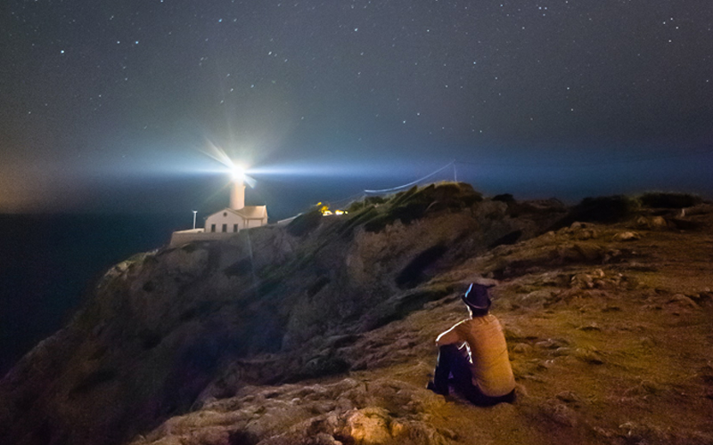 Lighthouse against the night sky