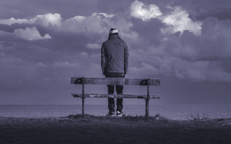 Man Standing by Bench