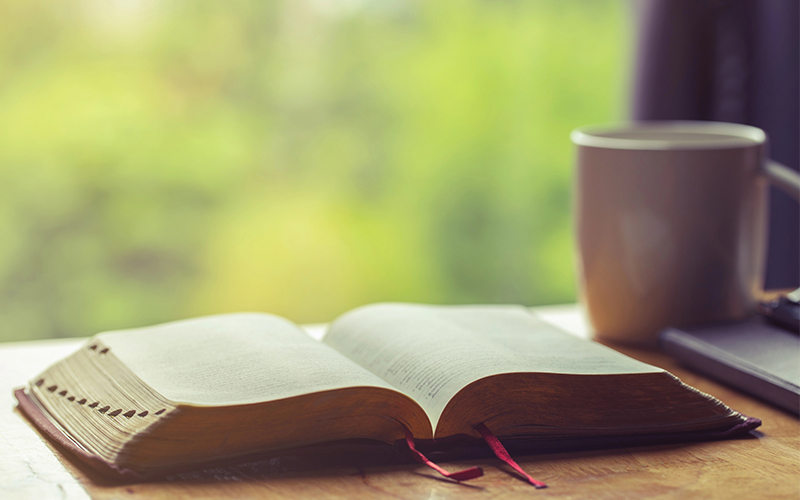 Open Bible with Coffee Cup