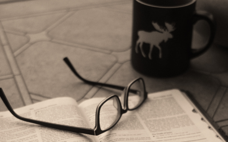 Open Bible and Coffee Mug